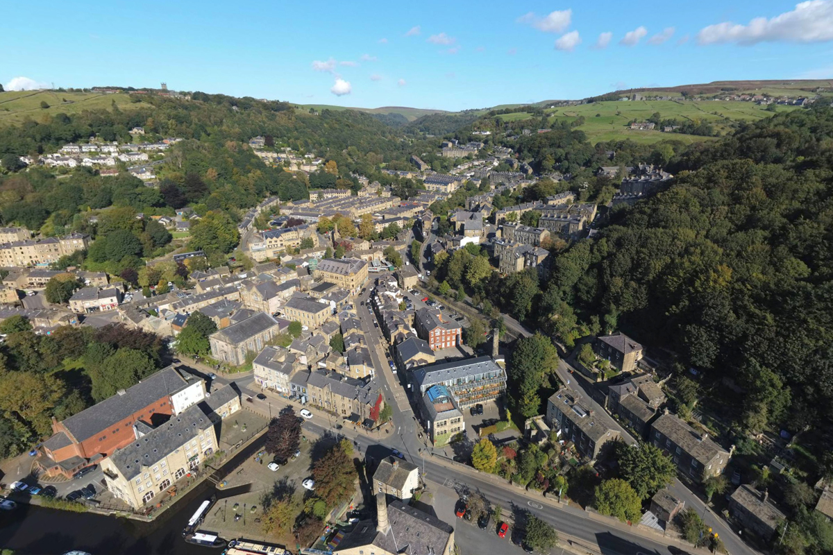 A view above Hebden Bridge, with the canal along the bottom, and the book launch venue to the bottom left